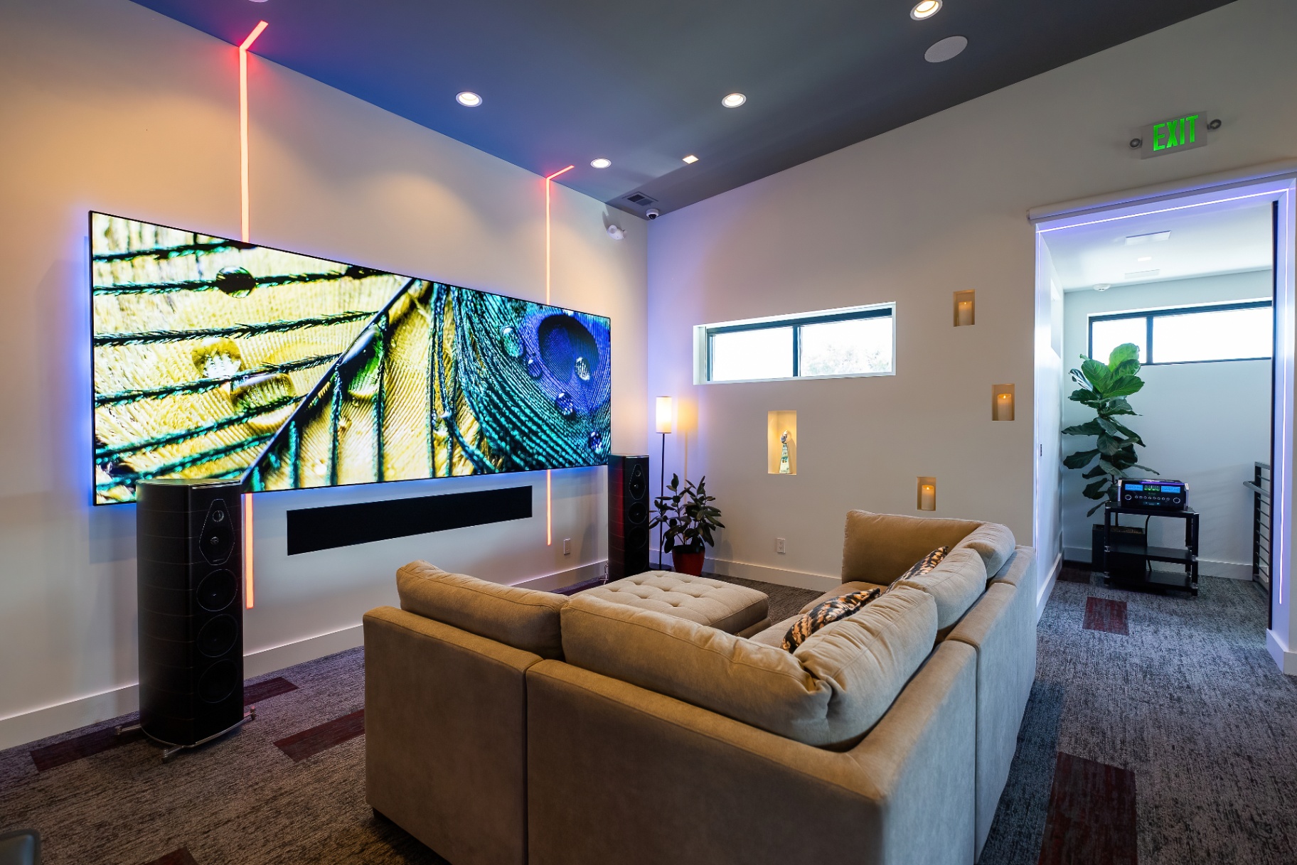 Modern media lounge with large screen and ambient lighting