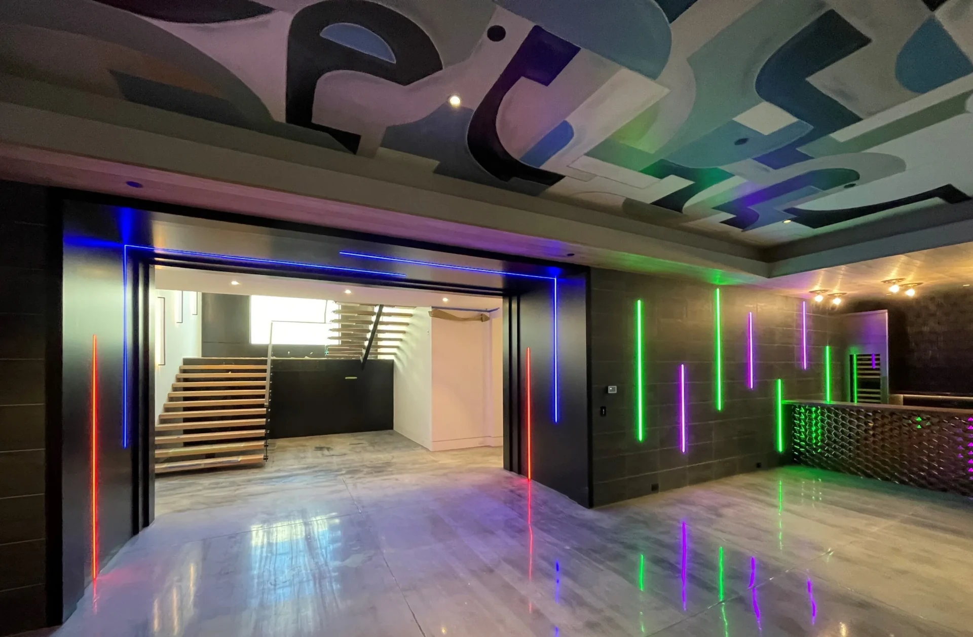 Custom home wall surfaces lit with accent lighting